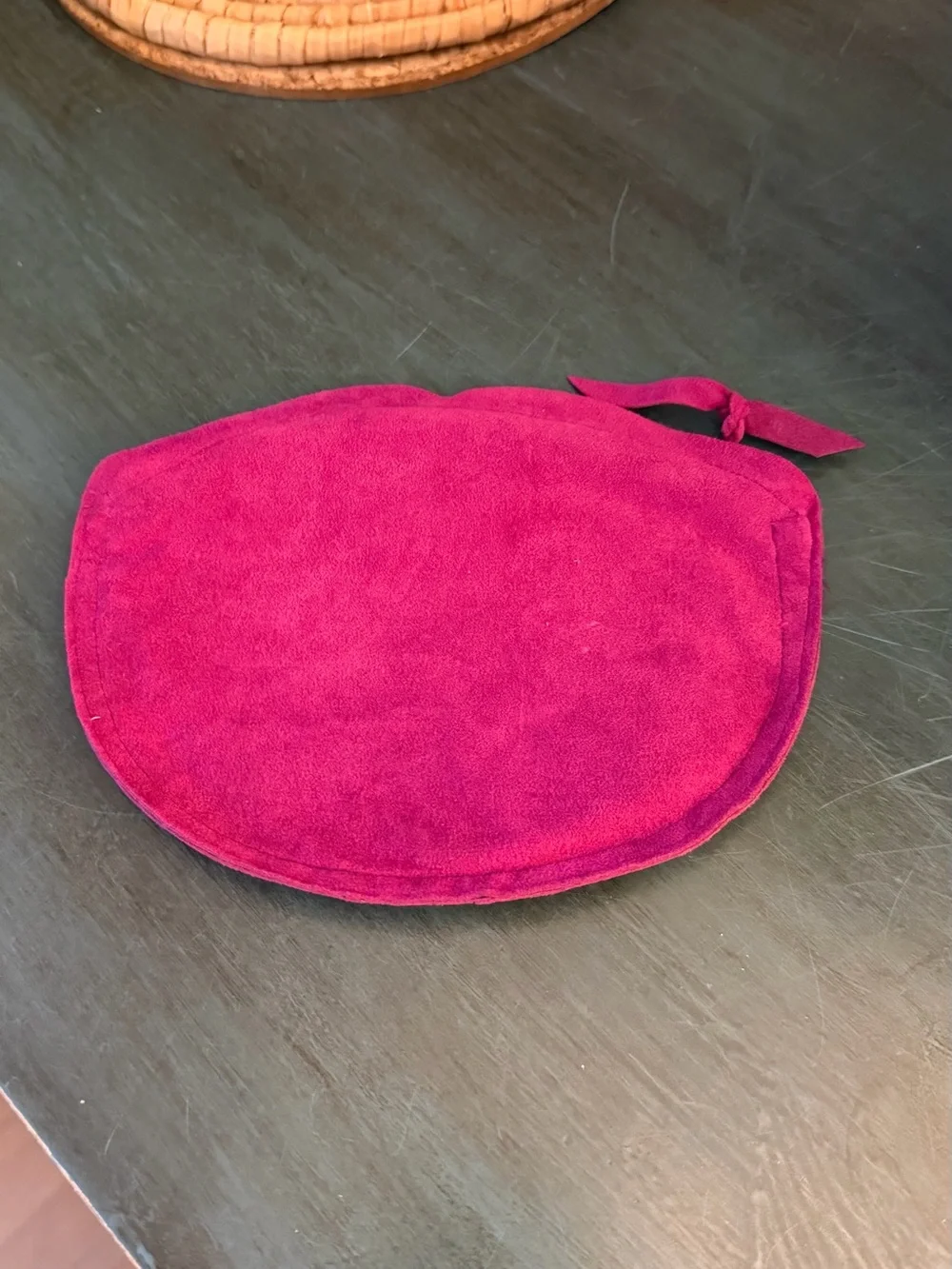 Maurice Keyloun New York magenta cosmetic pouch with zipper closure.